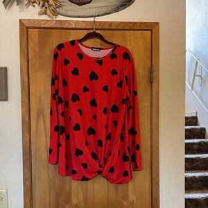 Trendy Red Long Sleeve Top with Black Heart Design